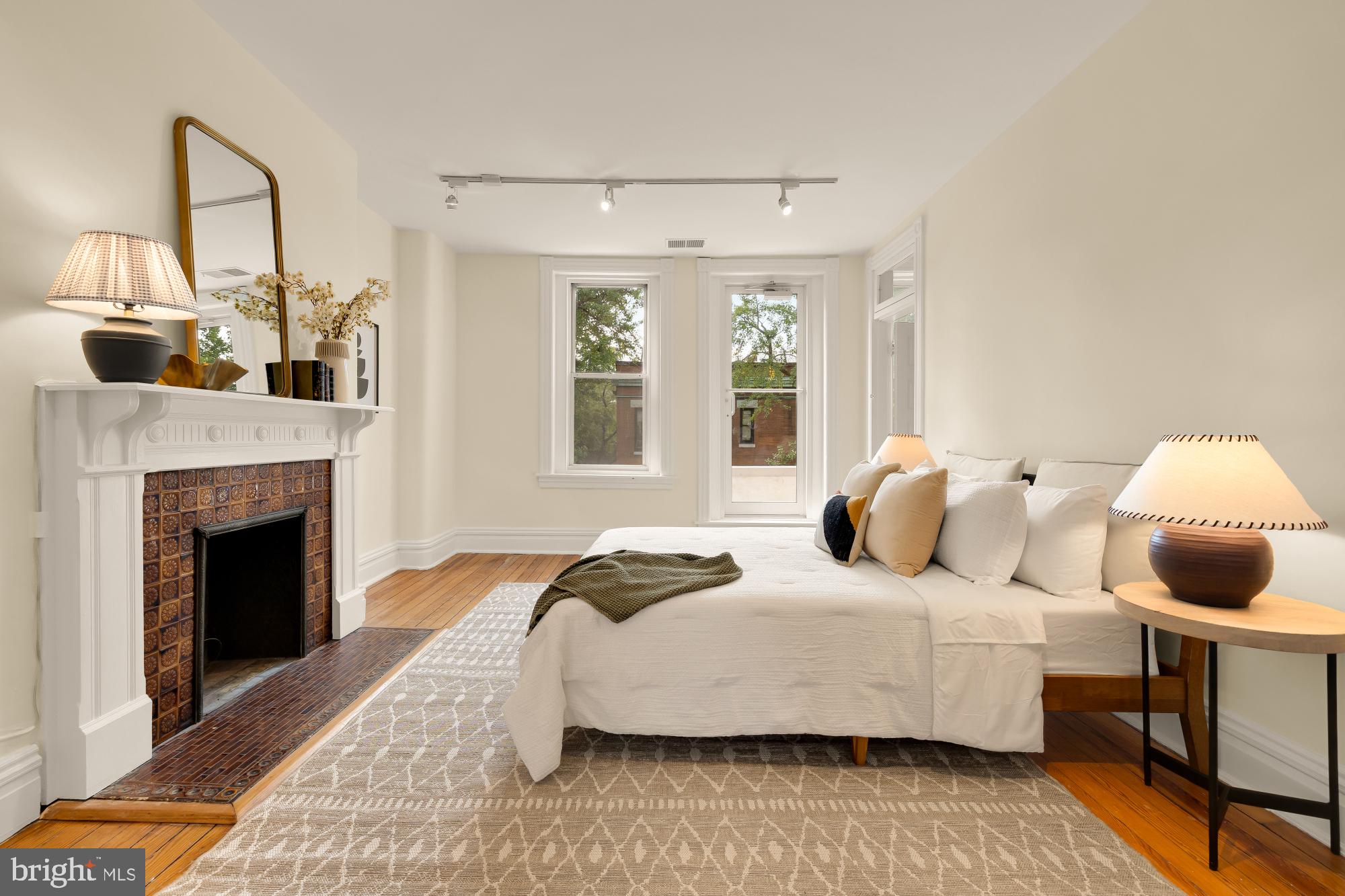 1735 Riggs Place Northwest Washington, DC 20009 - Photo 11 of 35 a bedroom with a bed and a fireplace