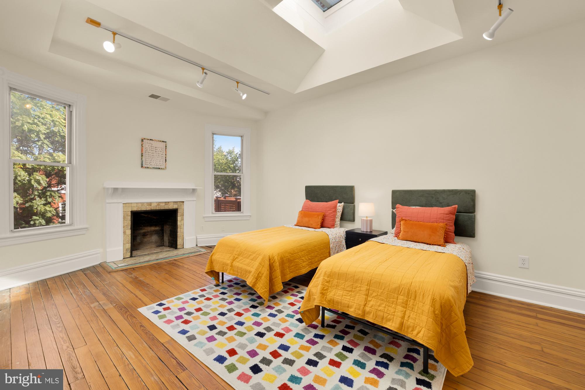 1735 Riggs Place Northwest Washington, DC 20009 - Photo 12 of 35 a bedroom with two beds and a fireplace