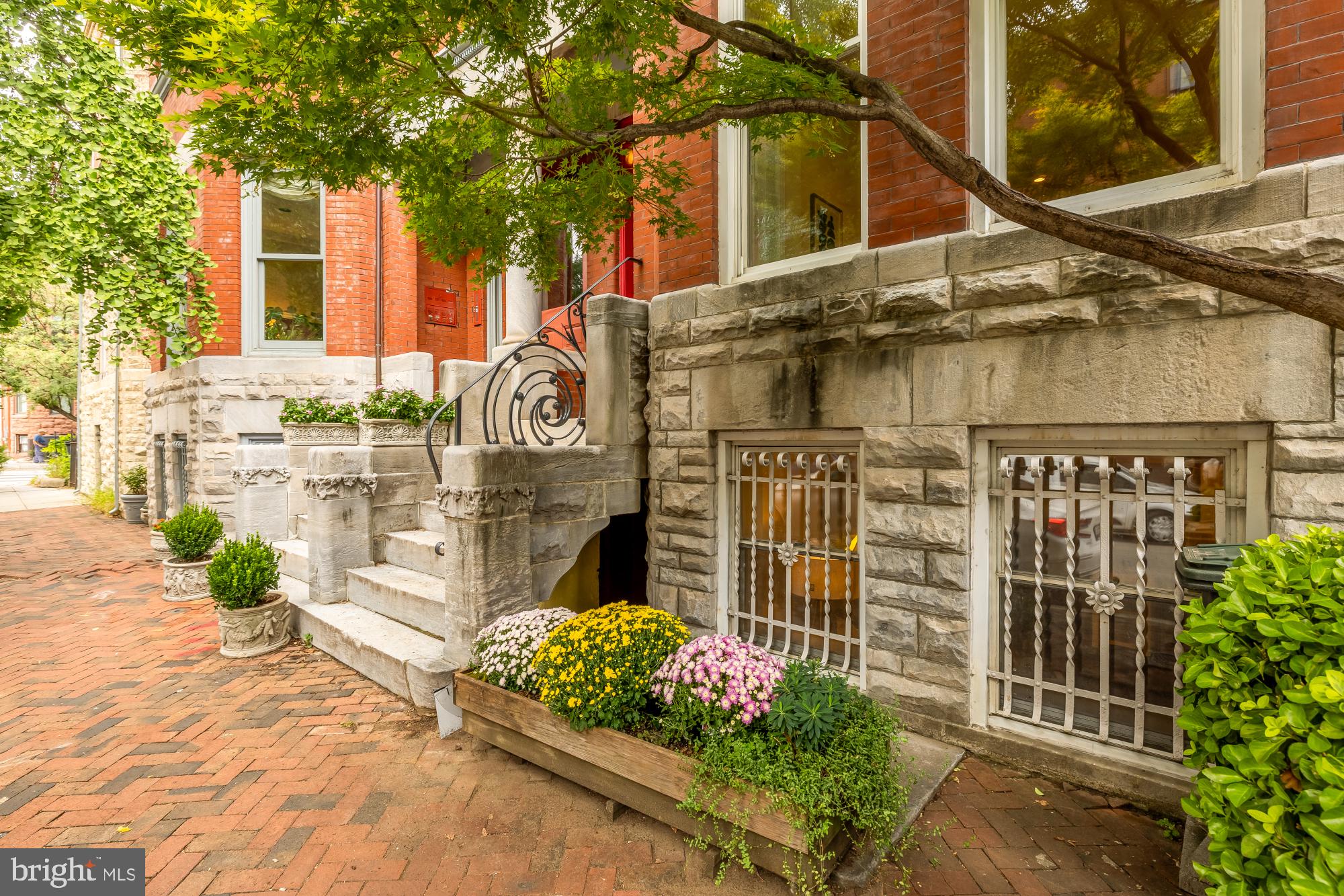 1735 Riggs Place Northwest Washington, DC 20009 - Photo 13 of 35 a front view of a house with a garden