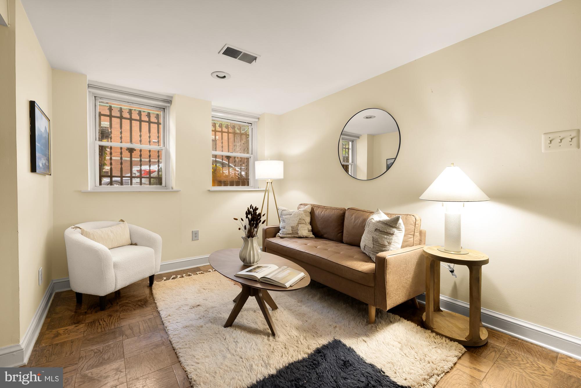 1735 Riggs Place Northwest Washington, DC 20009 - Photo 14 of 35 a living room with furniture a lamp and a window