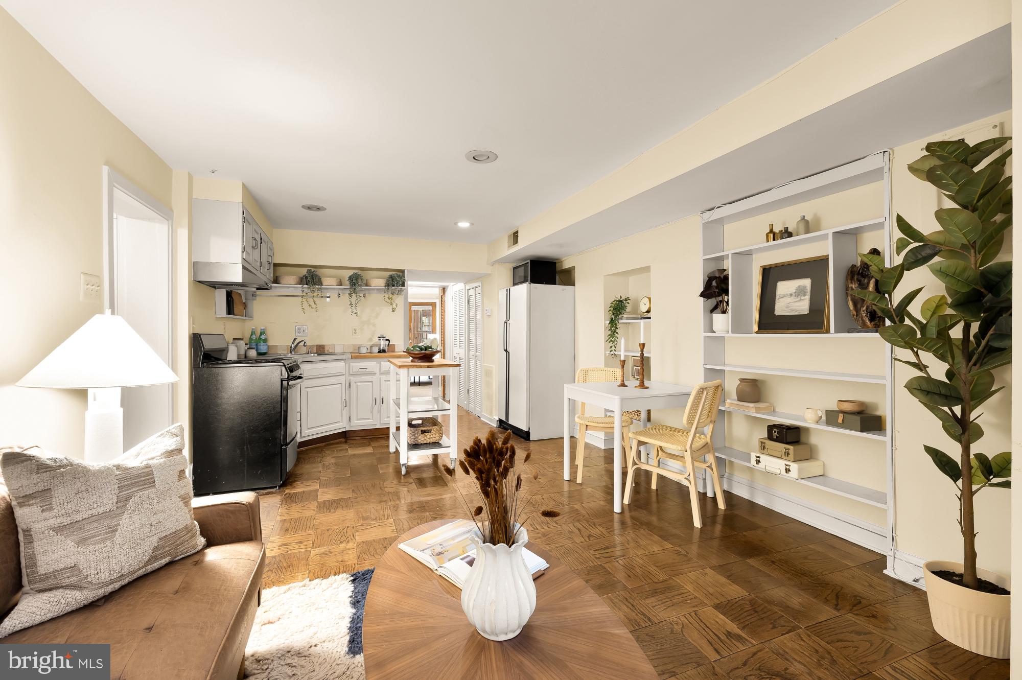 1735 Riggs Place Northwest Washington, DC 20009 - Photo 15 of 35 a living room with furniture and a chandelier