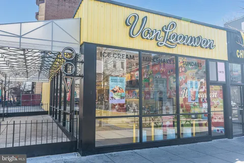 a view of a street with shops