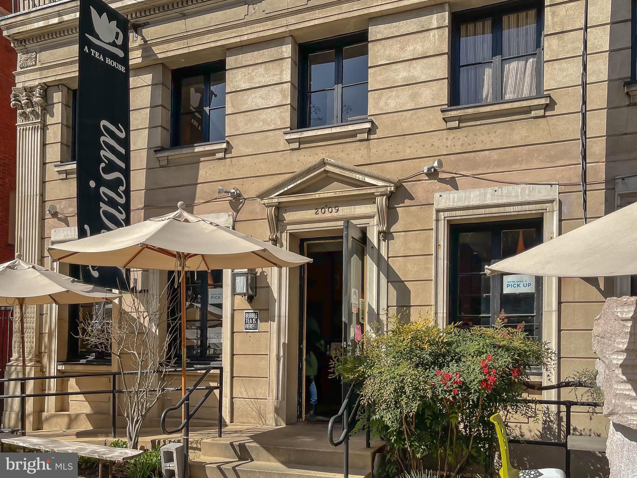 1735 Riggs Place Northwest Washington, DC 20009 - Photo 34 of 35 a front view of a house with plants