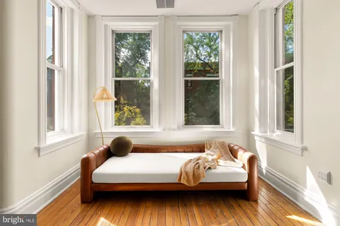 a bedroom with bed and window