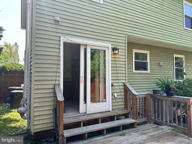 a view of house with patio outdoor seating and covered with chairs