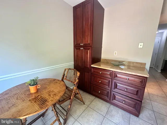 a view of a dining room with furniture and a window
