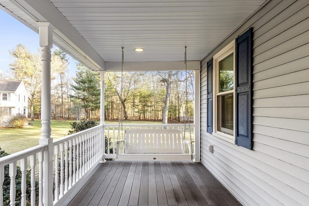 114 Patten Road Tewksbury, MA 01876 - Photo 3 of 39 a view of a room with wooden floor and iron stairs