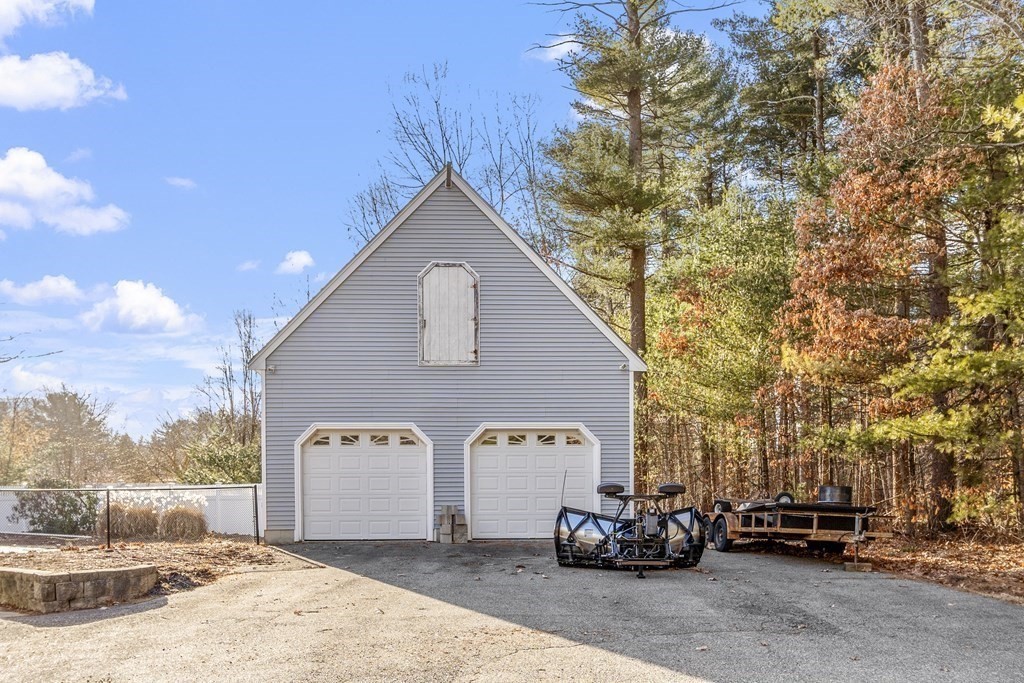 114 Patten Road Tewksbury, MA 01876 - Photo 5 of 39 a front view of a house with a yard