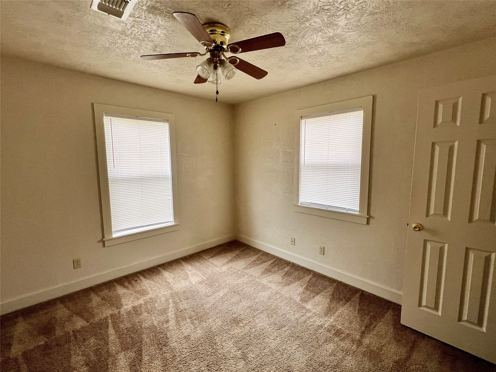 502 West Third Street Brenham, TX 77833 - Photo 4 of 6 a view of an empty room with a window