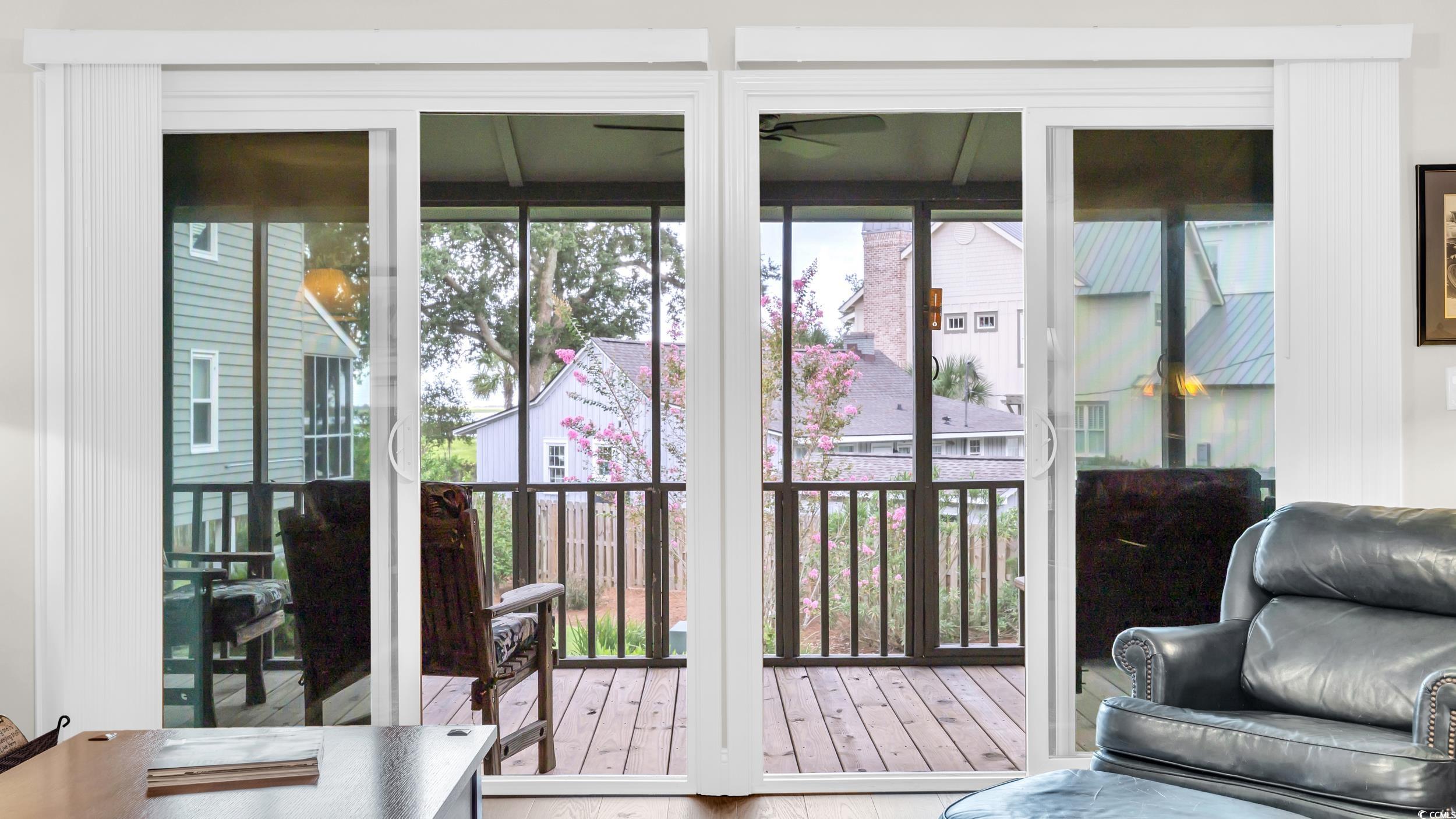 5137 Highway 17 Business, Unit 2B Murrells Inlet, SC 29576 - Photo 11 of 32 Doorway with healthy amount of natural light, wood finished floors, and ceiling fan