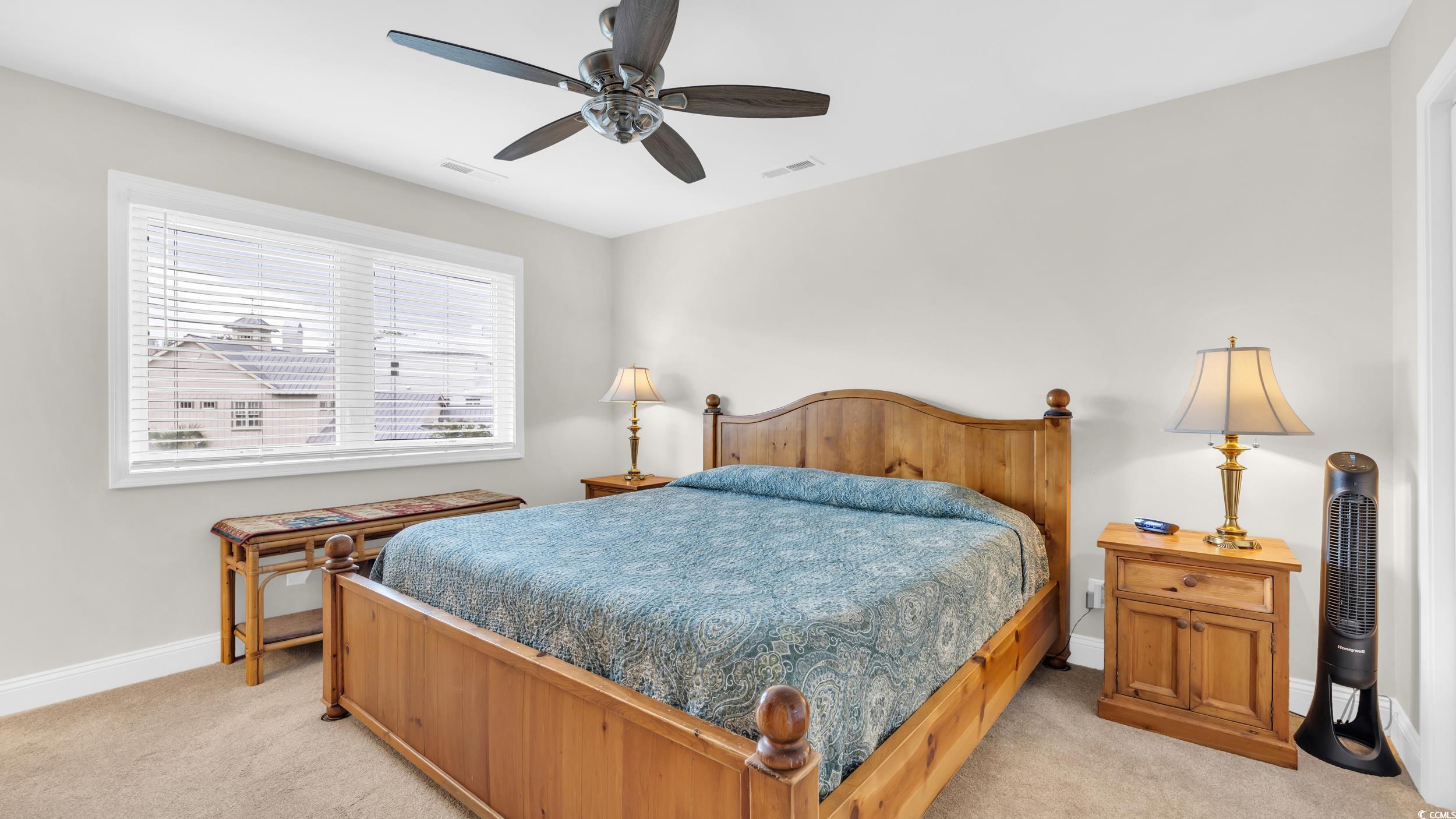 5137 Highway 17 Business, Unit 2B Murrells Inlet, SC 29576 - Photo 21 of 32 Bedroom featuring light carpet and a ceiling fan