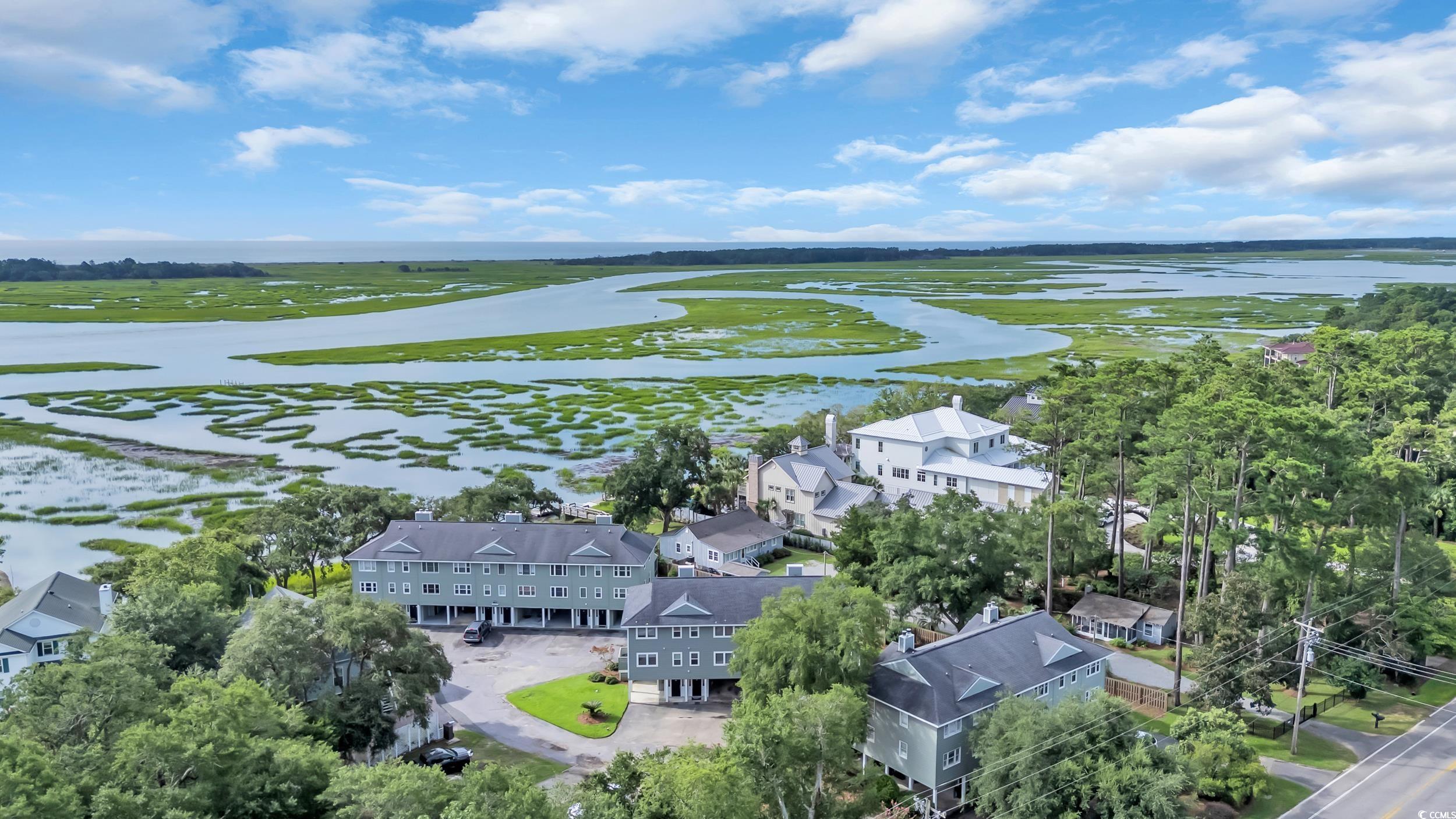 5137 Highway 17 Business, Unit 2B Murrells Inlet, SC 29576 - Photo 27 of 32 Aerial view of residential area featuring a nearby body of water