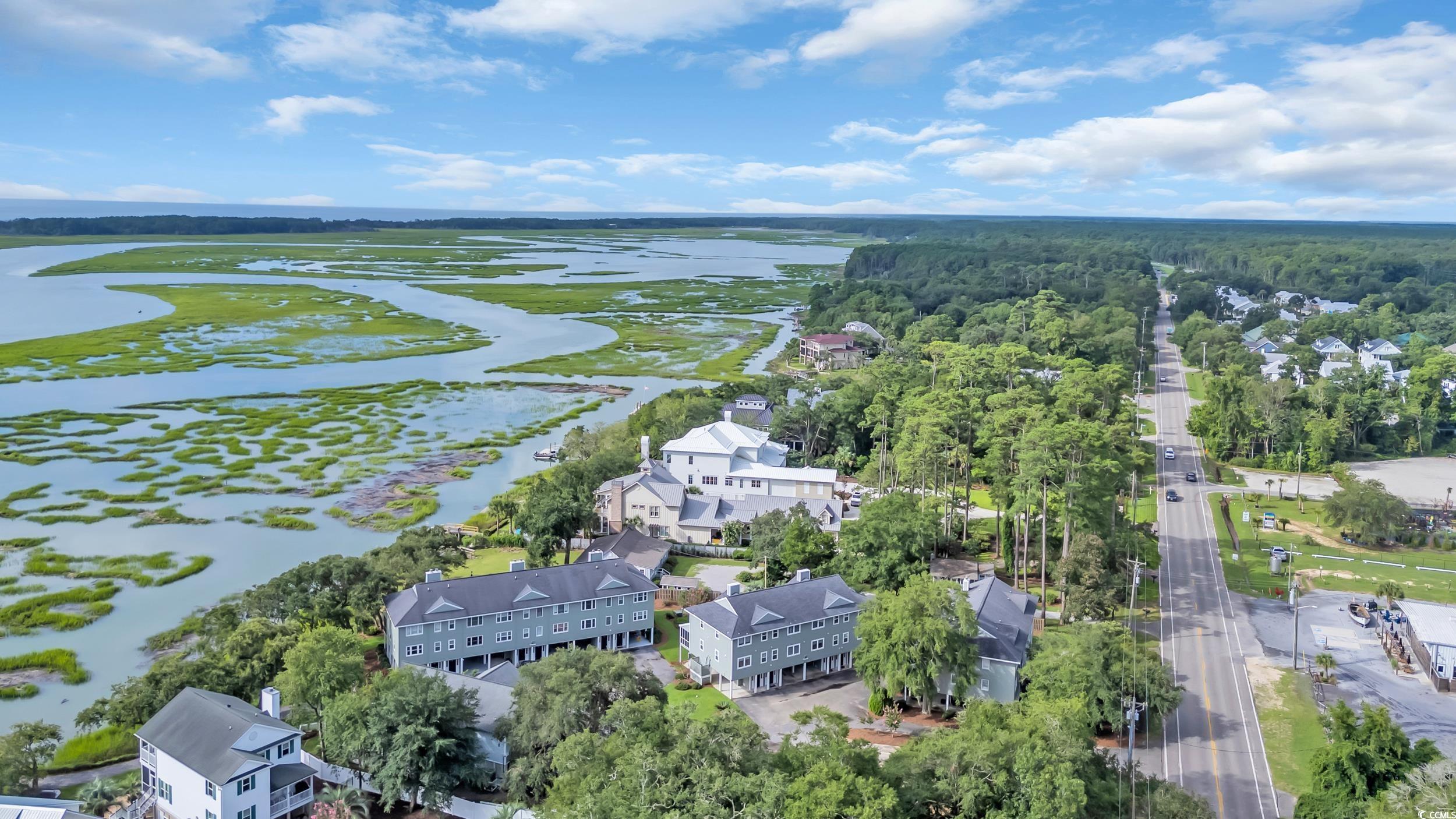 5137 Highway 17 Business, Unit 2B Murrells Inlet, SC 29576 - Photo 28 of 32 Aerial view of residential area with a large body of water