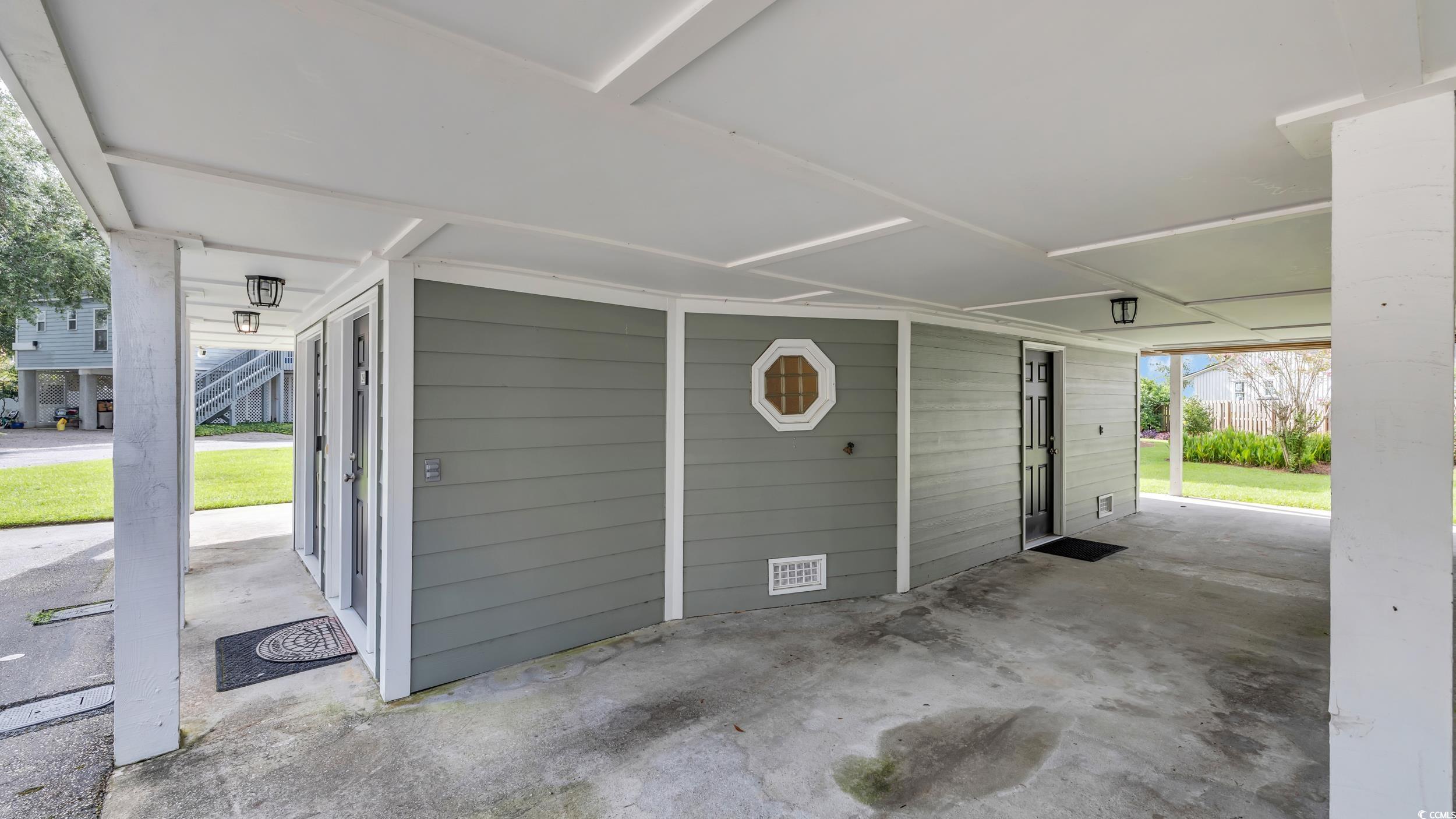 5137 Highway 17 Business, Unit 2B Murrells Inlet, SC 29576 - Photo 3 of 32 Garage featuring a carport