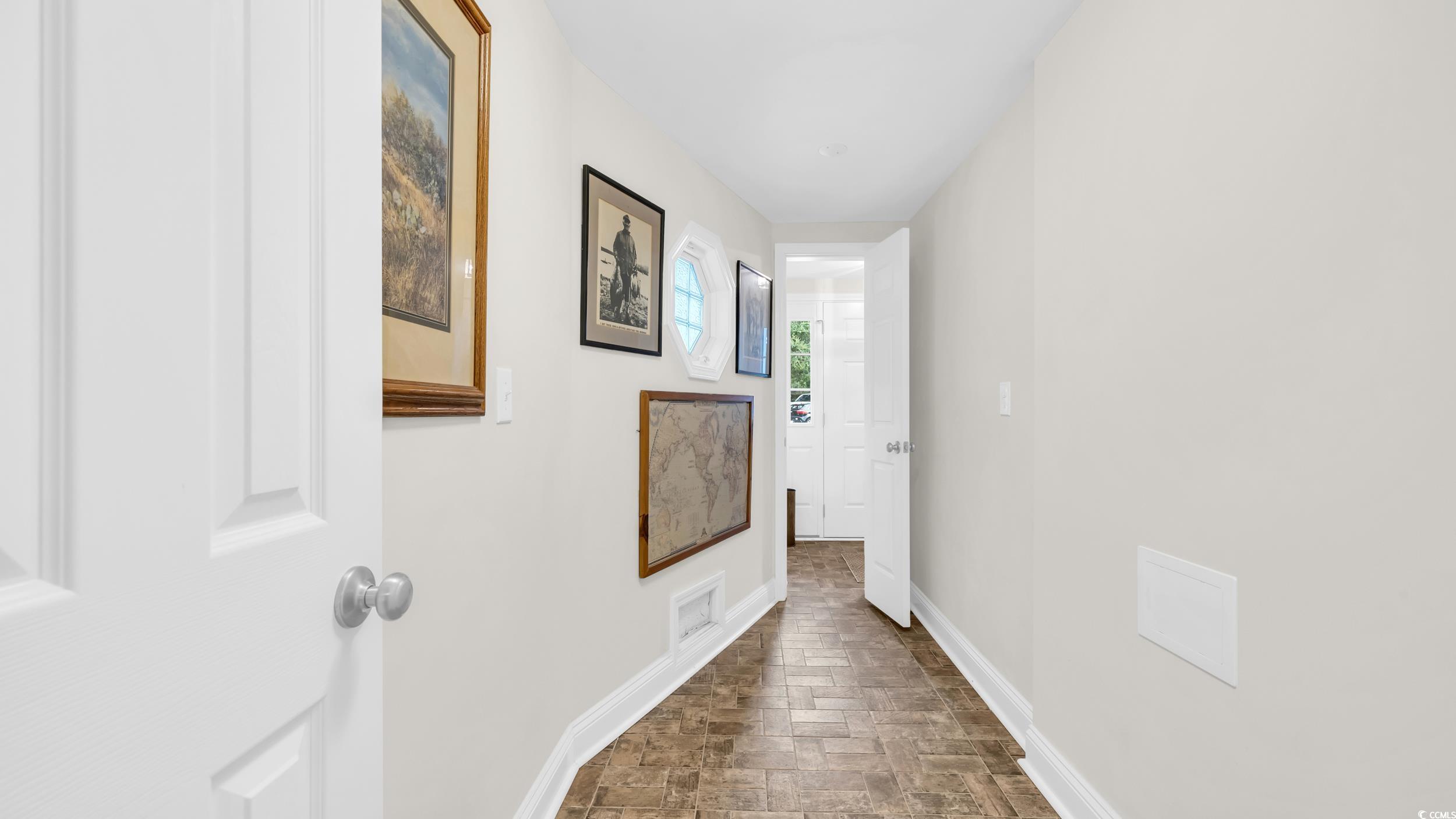 5137 Highway 17 Business, Unit 2B Murrells Inlet, SC 29576 - Photo 6 of 32 Hallway featuring baseboards and brick patterned flooring
