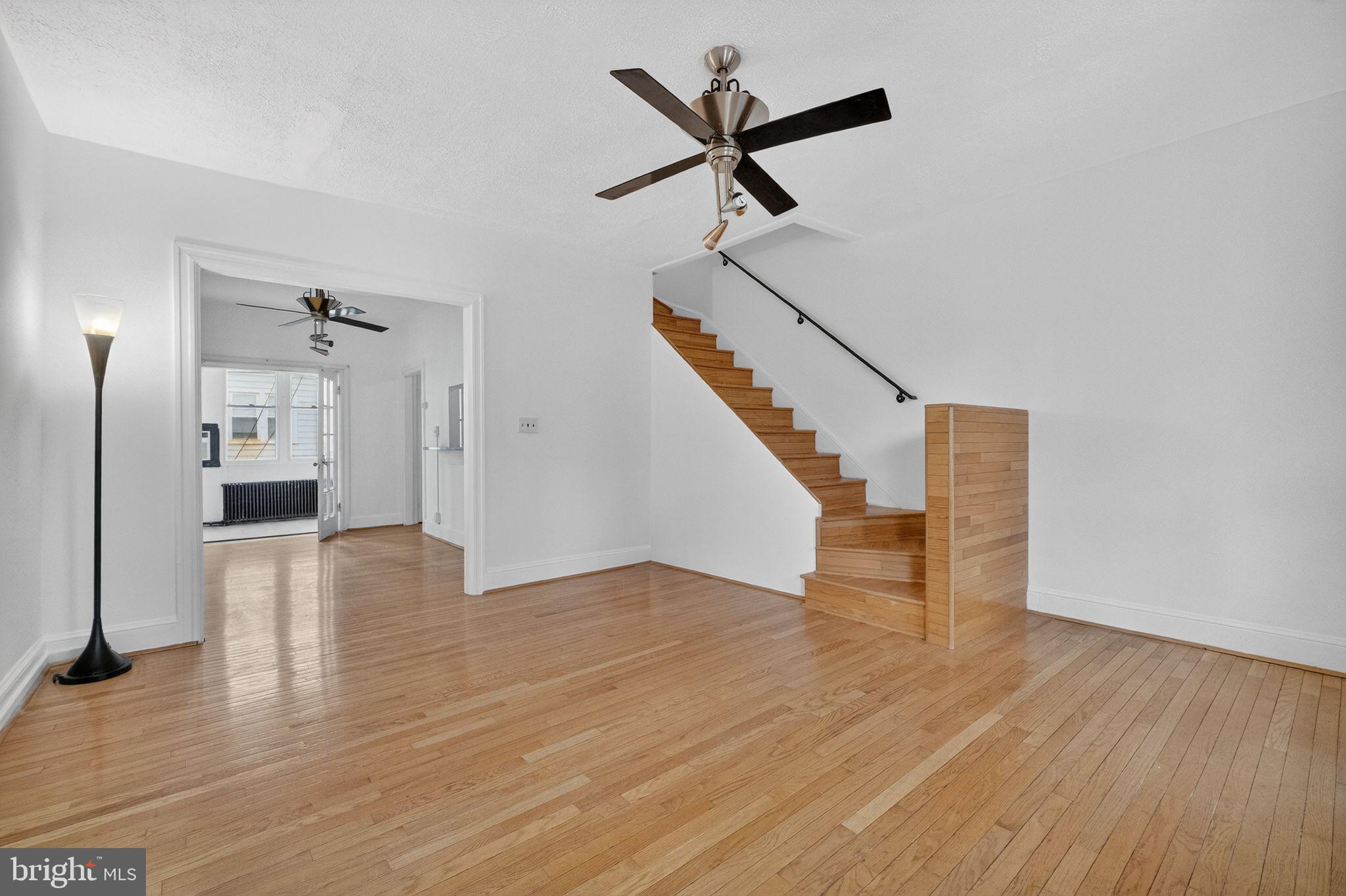 206 Cromwell Terrace Northeast Washington, DC 20002 - Photo 2 of 17 a view of empty room with wooden floor and window