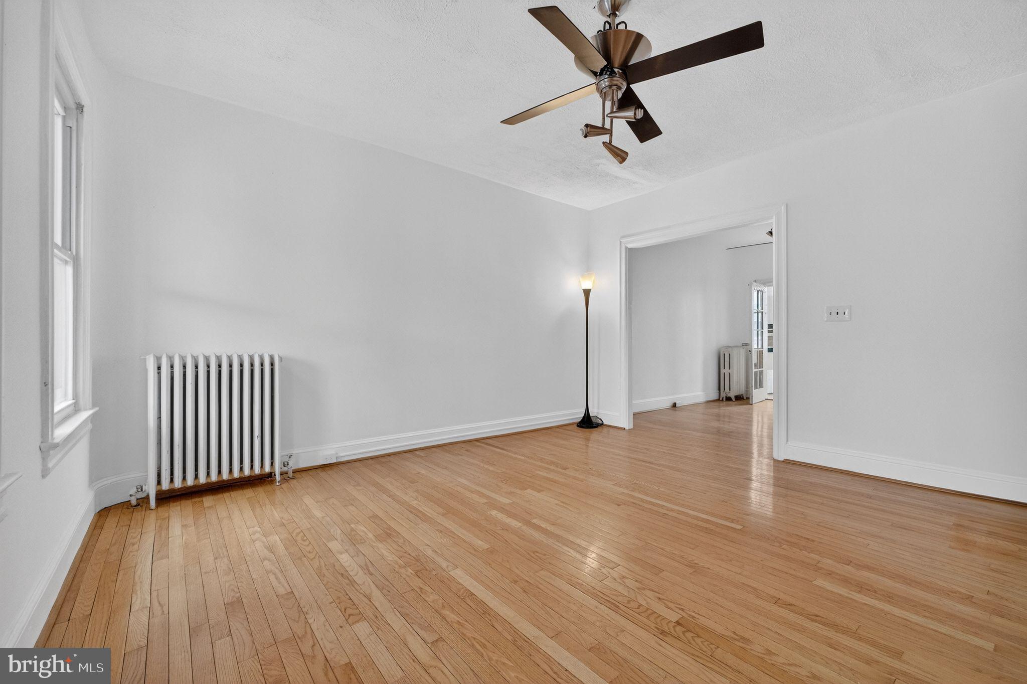 206 Cromwell Terrace Northeast Washington, DC 20002 - Photo 5 of 17 wooden floor in an empty room
