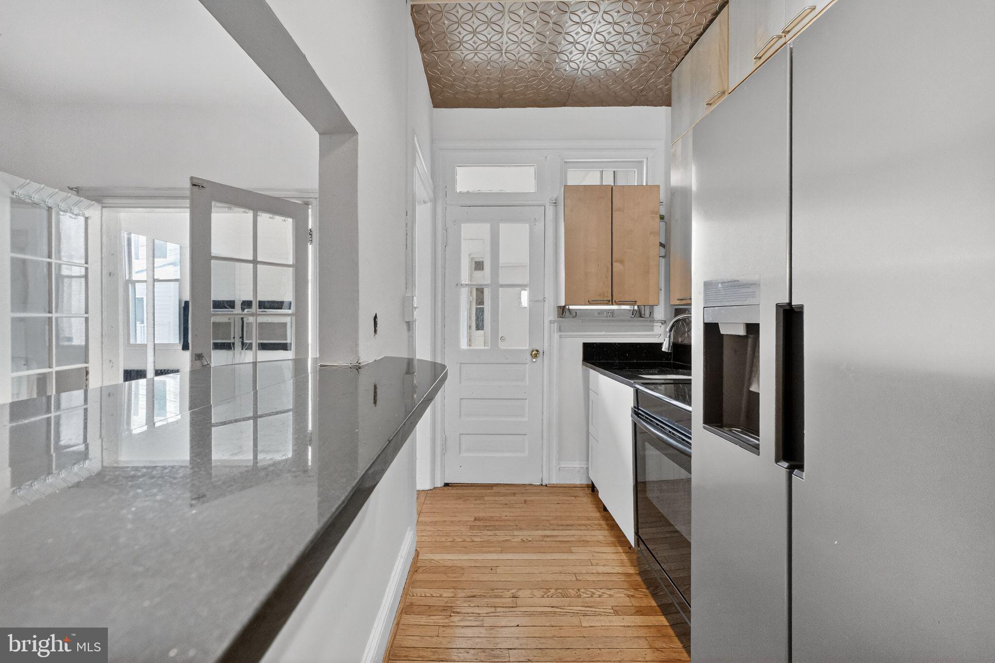 206 Cromwell Terrace Northeast Washington, DC 20002 - Photo 8 of 17 a kitchen with stainless steel appliances a refrigerator and a stove