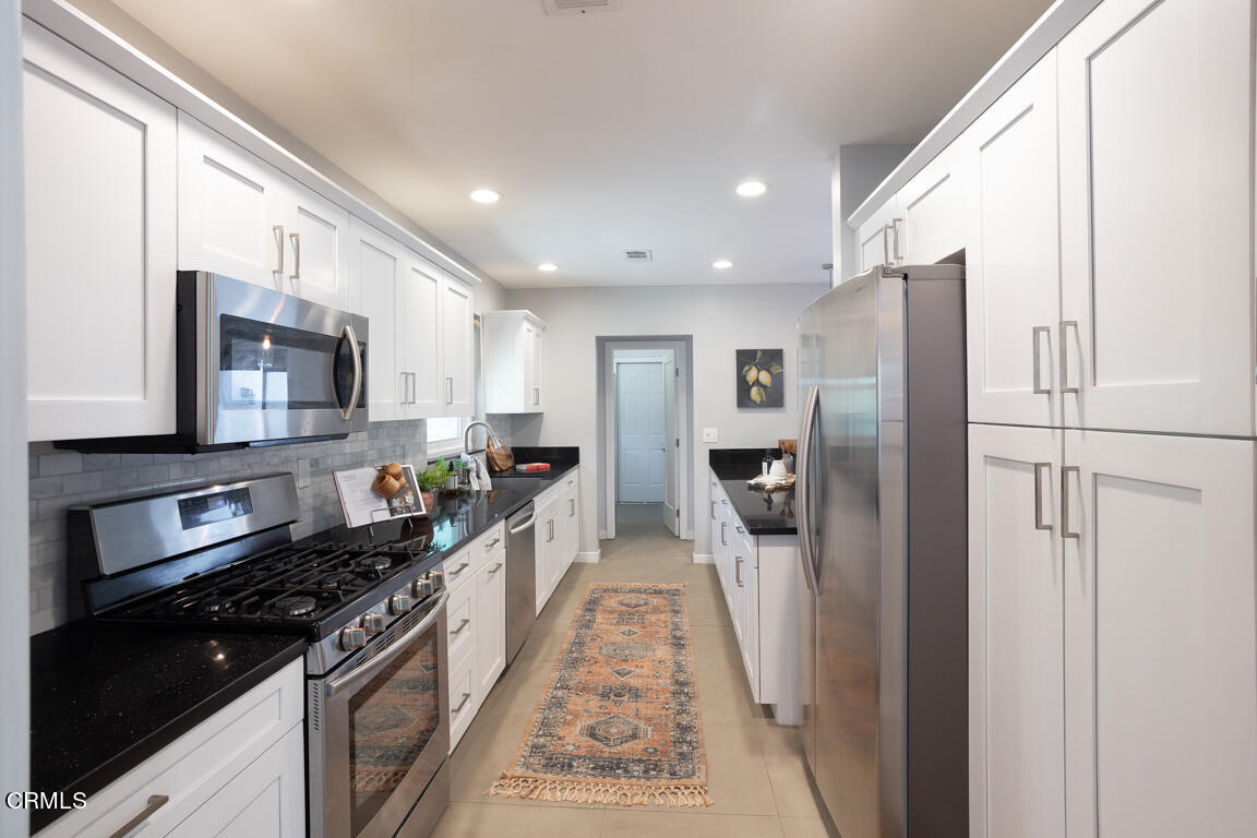 419 Cambridge Drive Burbank, CA 91504 - Photo 12 of 38 a kitchen with stainless steel appliances granite countertop a refrigerator and a stove