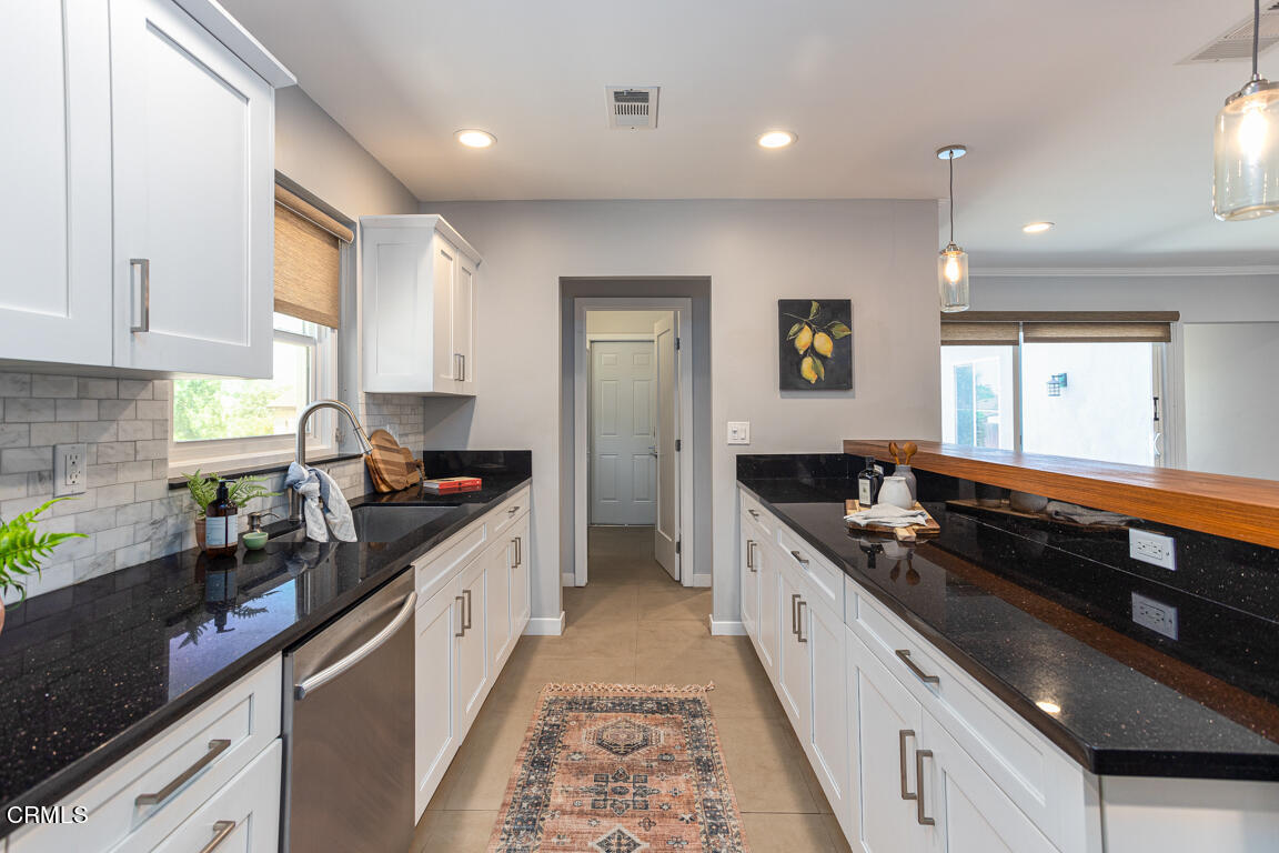419 Cambridge Drive Burbank, CA 91504 - Photo 14 of 38 a kitchen with stainless steel appliances granite countertop a stove a sink and a refrigerator
