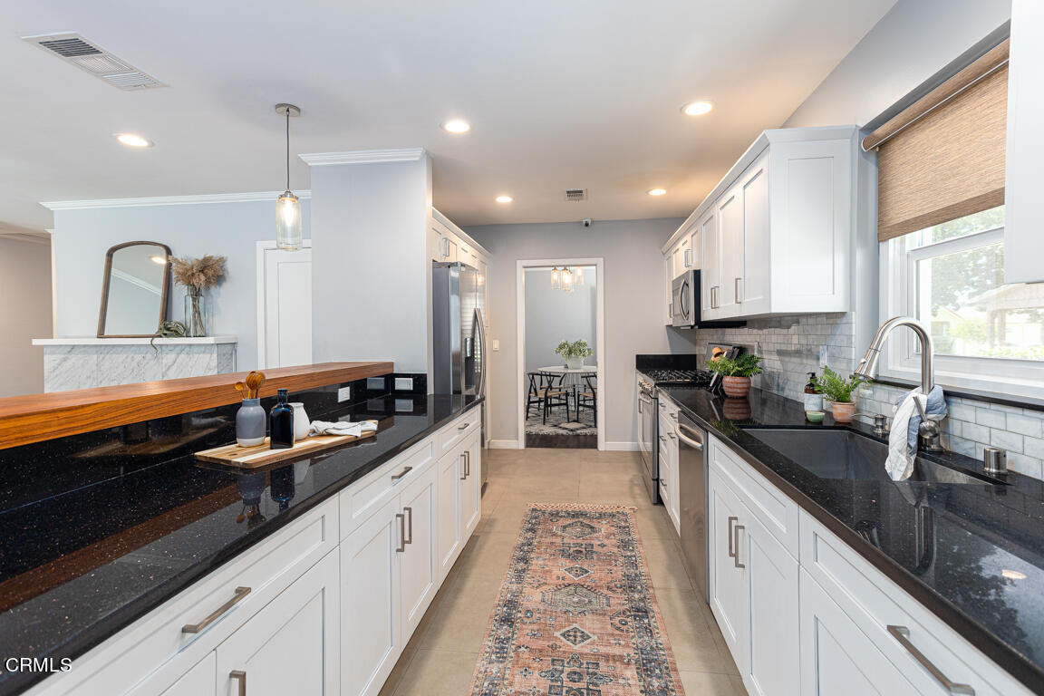 419 Cambridge Drive Burbank, CA 91504 - Photo 16 of 38 a large kitchen with granite countertop lots of counter space and sink