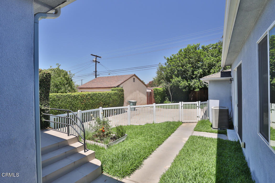 419 Cambridge Drive Burbank, CA 91504 - Photo 33 of 38 a view of a patio with table and chairs potted plants with wooden floor