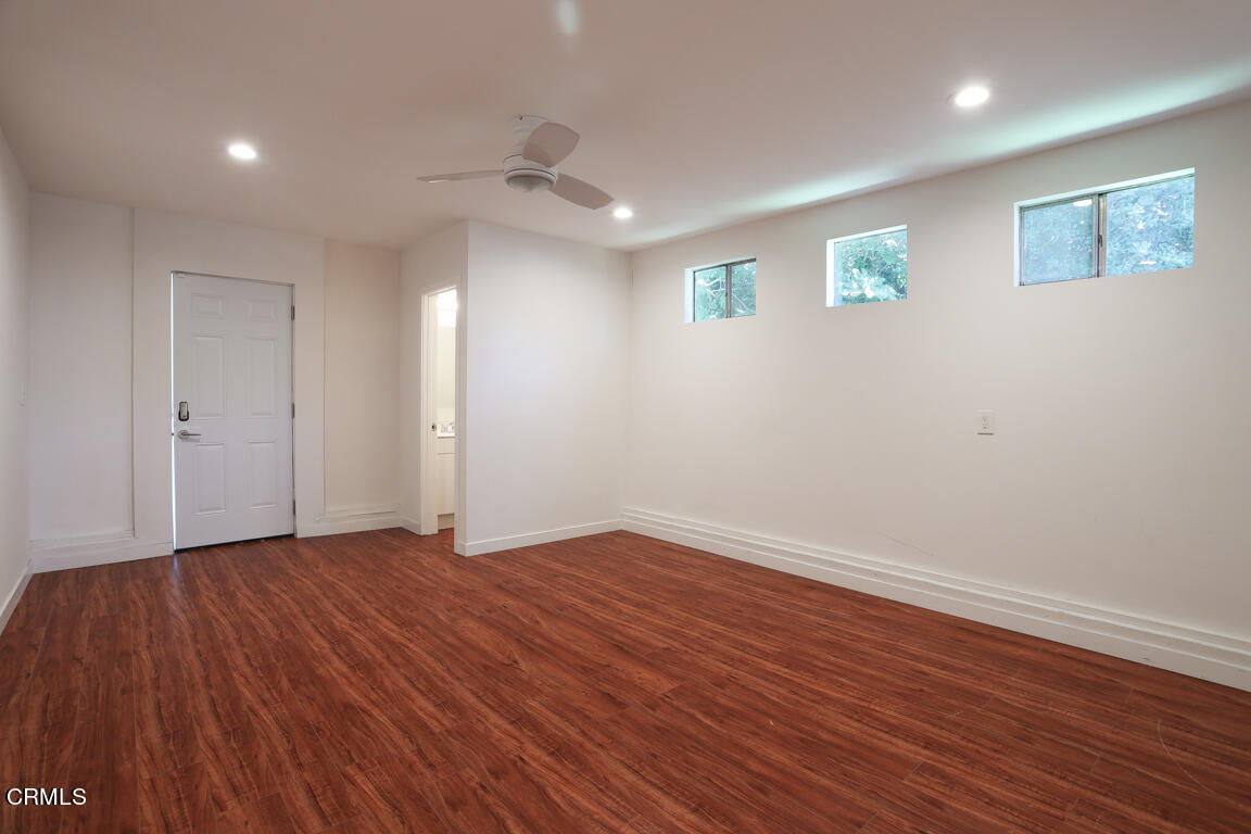 419 Cambridge Drive Burbank, CA 91504 - Photo 37 of 38 an empty room with wooden floor and windows