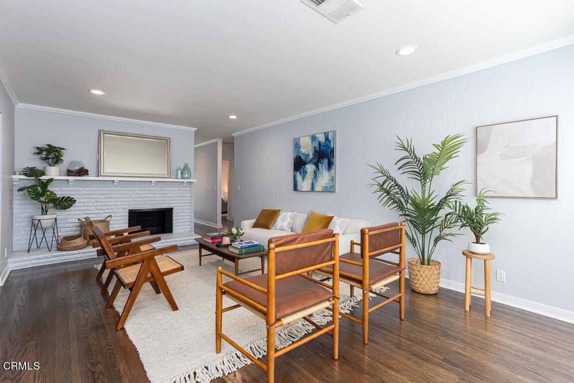 419 Cambridge Drive Burbank, CA 91504 - Photo 4 of 38 a living room with furniture and a fireplace