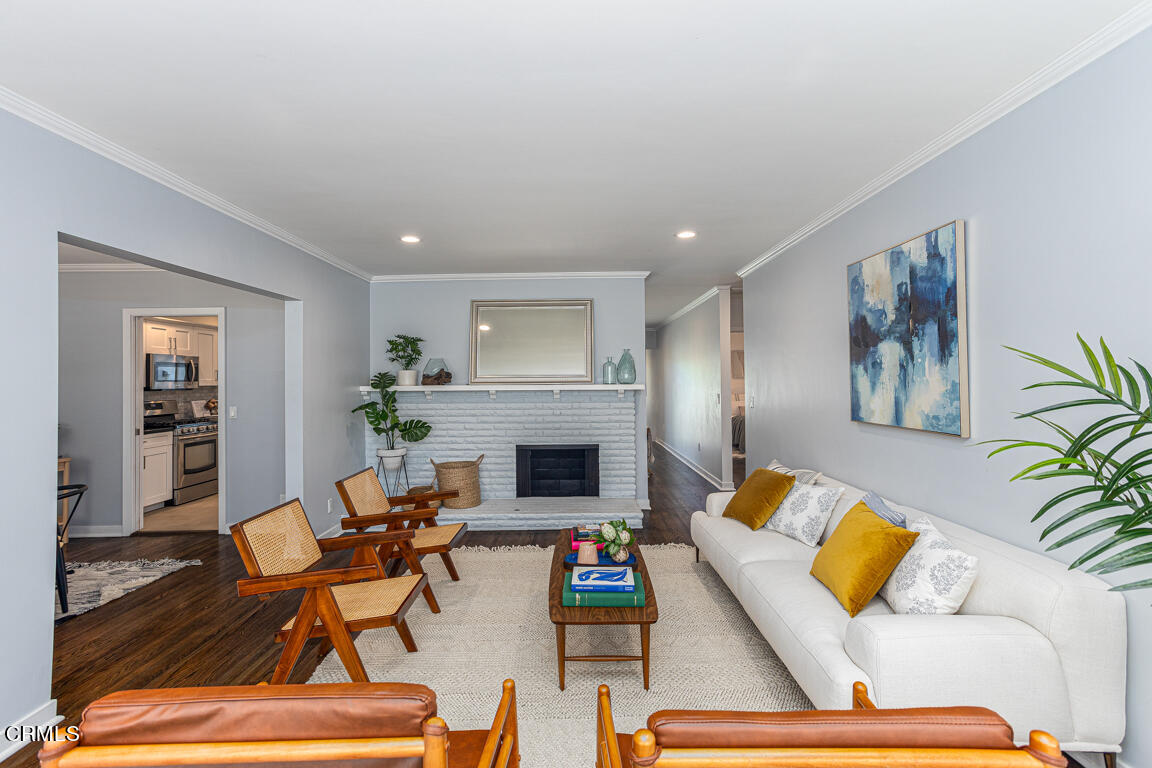 419 Cambridge Drive Burbank, CA 91504 - Photo 5 of 38 a living room with furniture and a fireplace