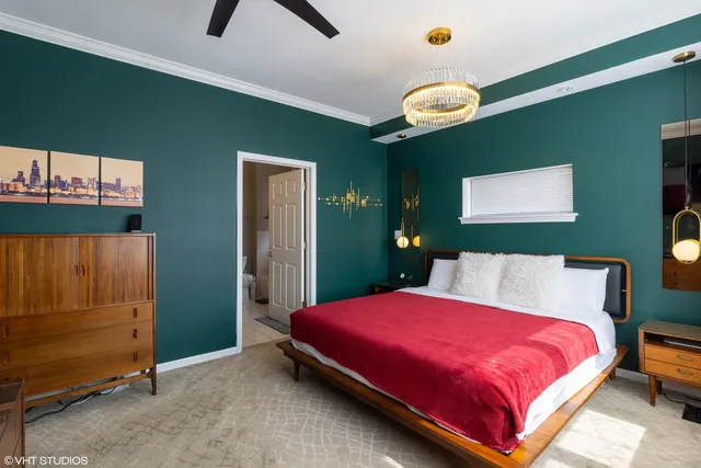 a bedroom with a bed and a dresser