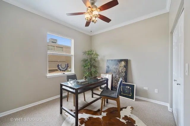 a workspace with furniture and a potted plant