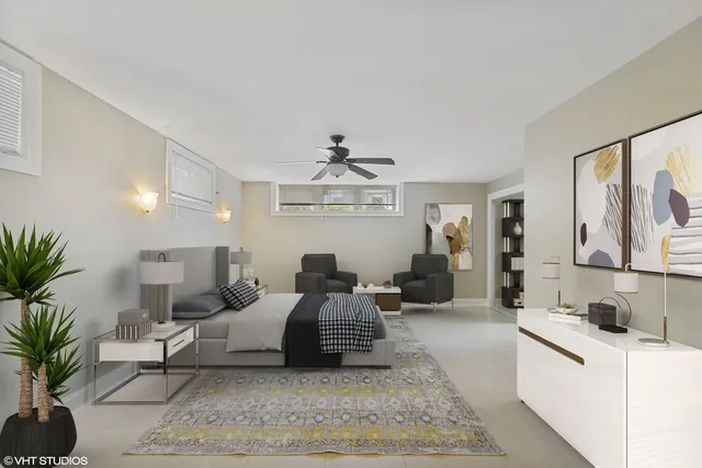 a living room with furniture potted plant and a window