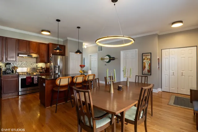 a view of a dining room with furniture and wooden floor