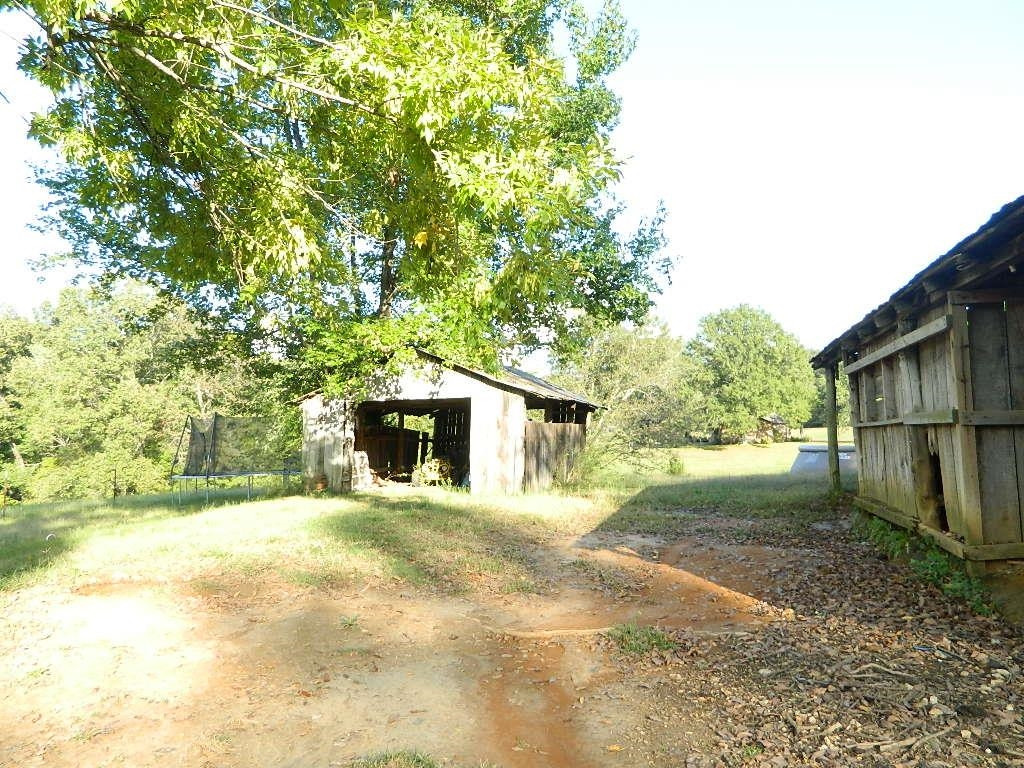 1180 Bennetts Road Huntingdon, TN 38344 - Photo 18 of 19 a view of a house with a yard