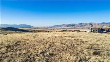 a view of an ocean with a mountain