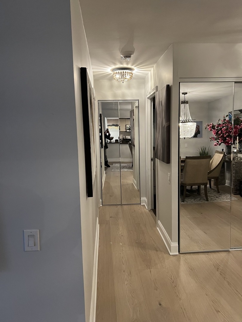 110 East Delaware Place, Unit 2003 Chicago, IL 60611 - Photo 8 of 11 a view of a hallway