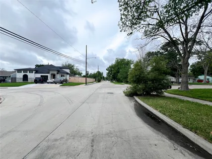 a view of a street with a building in the background
