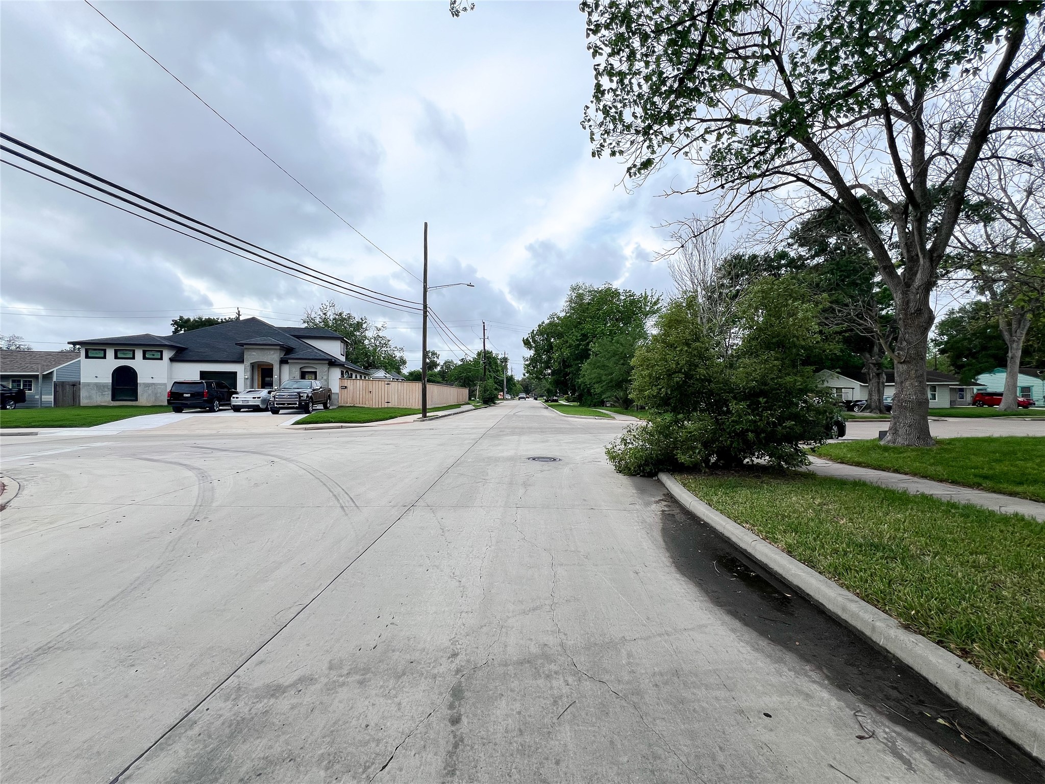 5863 Southgood Street Houston, TX 77033 - Photo 4 of 6 a view of a street with a building in the background