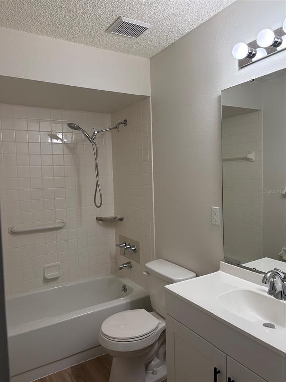 1455 Ridge Lake Court Lakeland, FL 33801 - Photo 12 of 15 a bathroom with a sink toilet and shower
