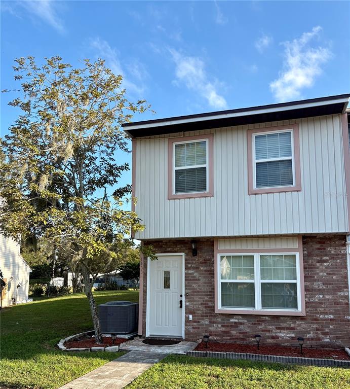 1455 Ridge Lake Court Lakeland, FL 33801 - Photo 2 of 15 a front view of a house with a yard