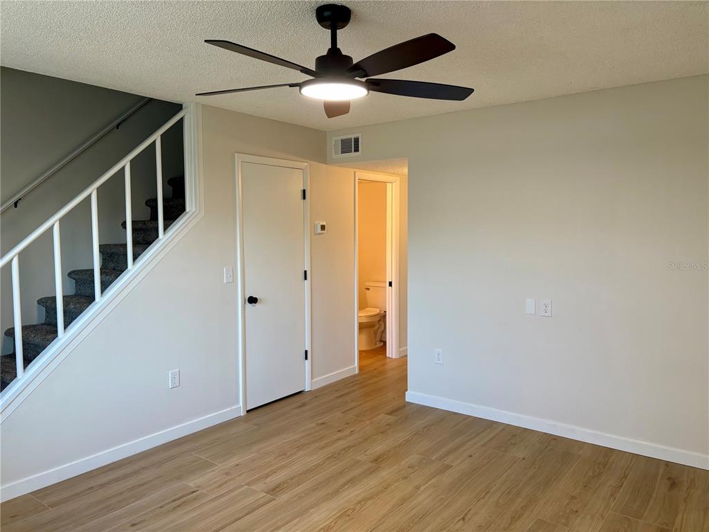 1455 Ridge Lake Court Lakeland, FL 33801 - Photo 3 of 15 a view of an empty room with wooden floor