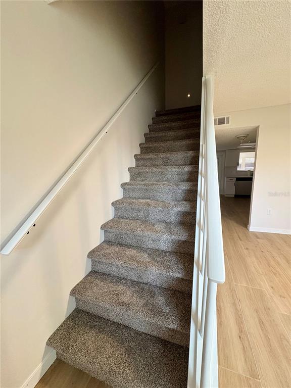 1455 Ridge Lake Court Lakeland, FL 33801 - Photo 8 of 15 a view of entryway and hall with wooden floor