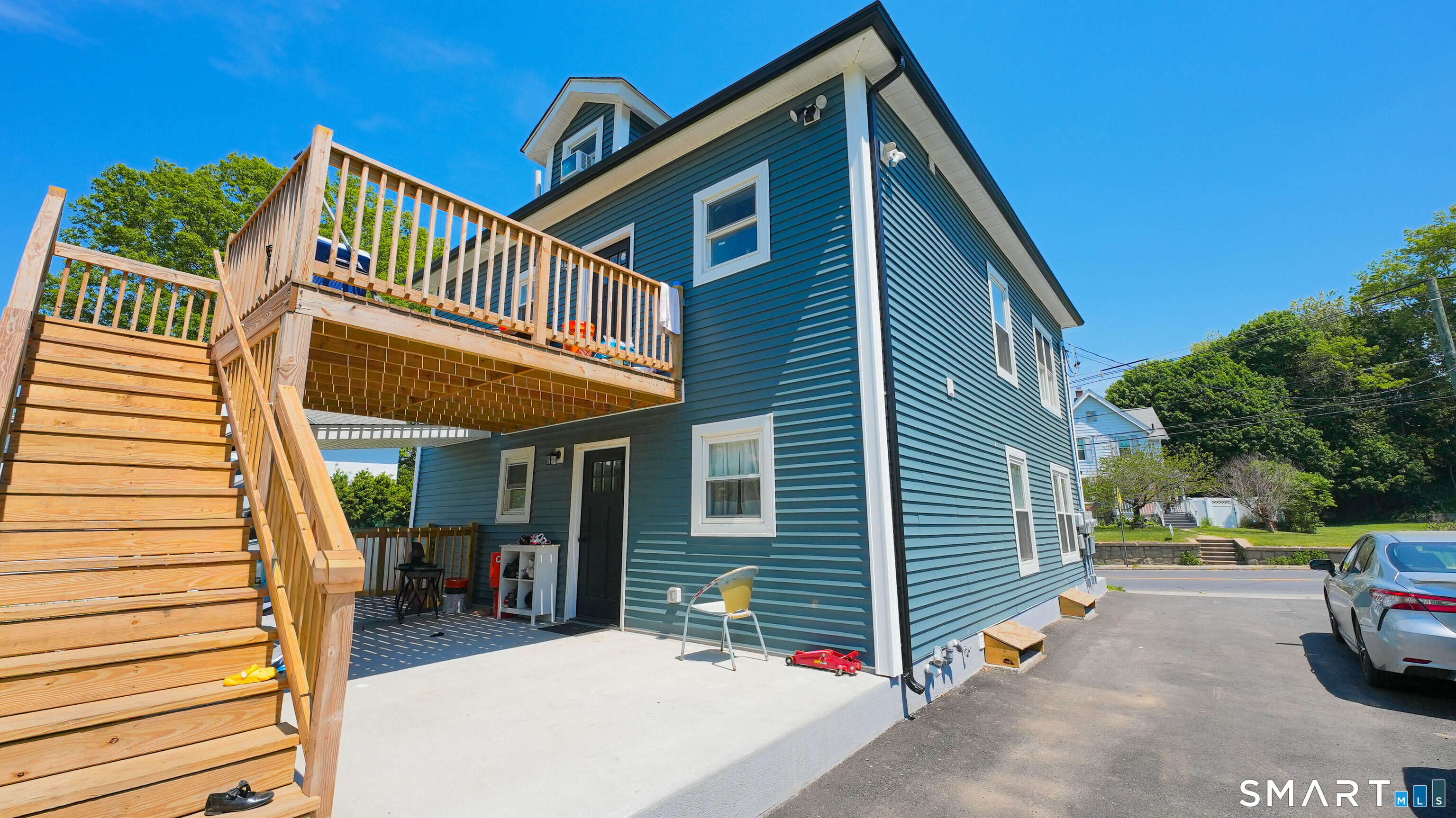 849 Frost Road Waterbury, CT 06705 - Photo 35 of 36 a view of a house with a yard and deck