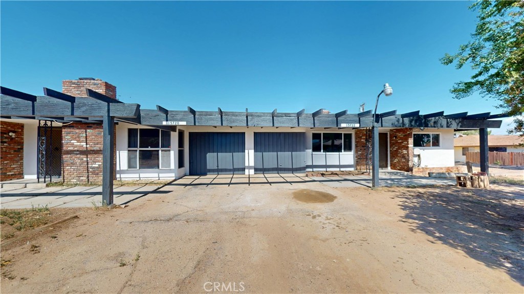 15722 Sago Road Apple Valley, CA 92307 - Photo 1 of 1 a view of a house with a outdoor space