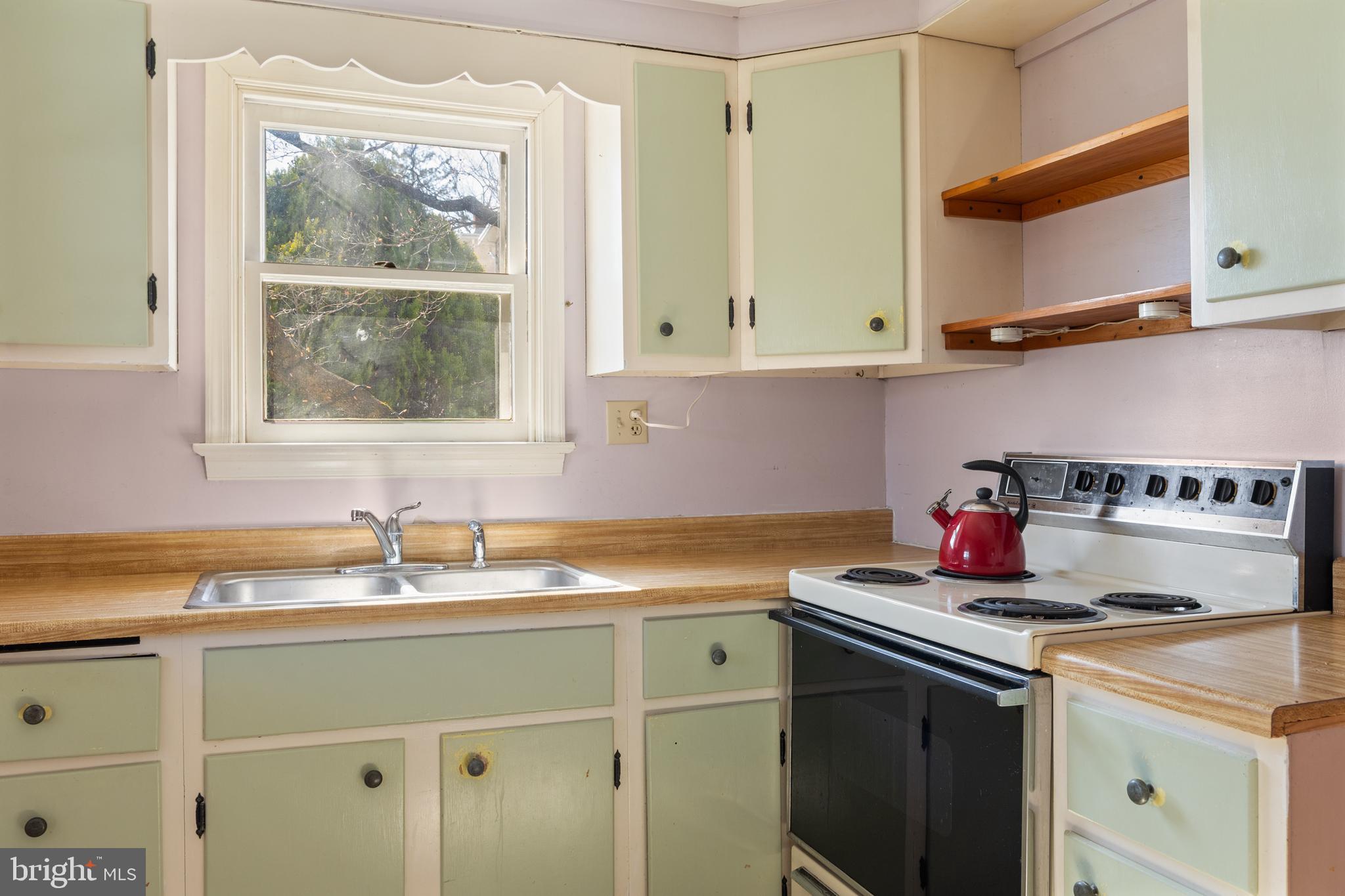 254 Chestnut Street Spring City, PA 19475 - Photo 16 of 37 a kitchen with a sink cabinets and a window