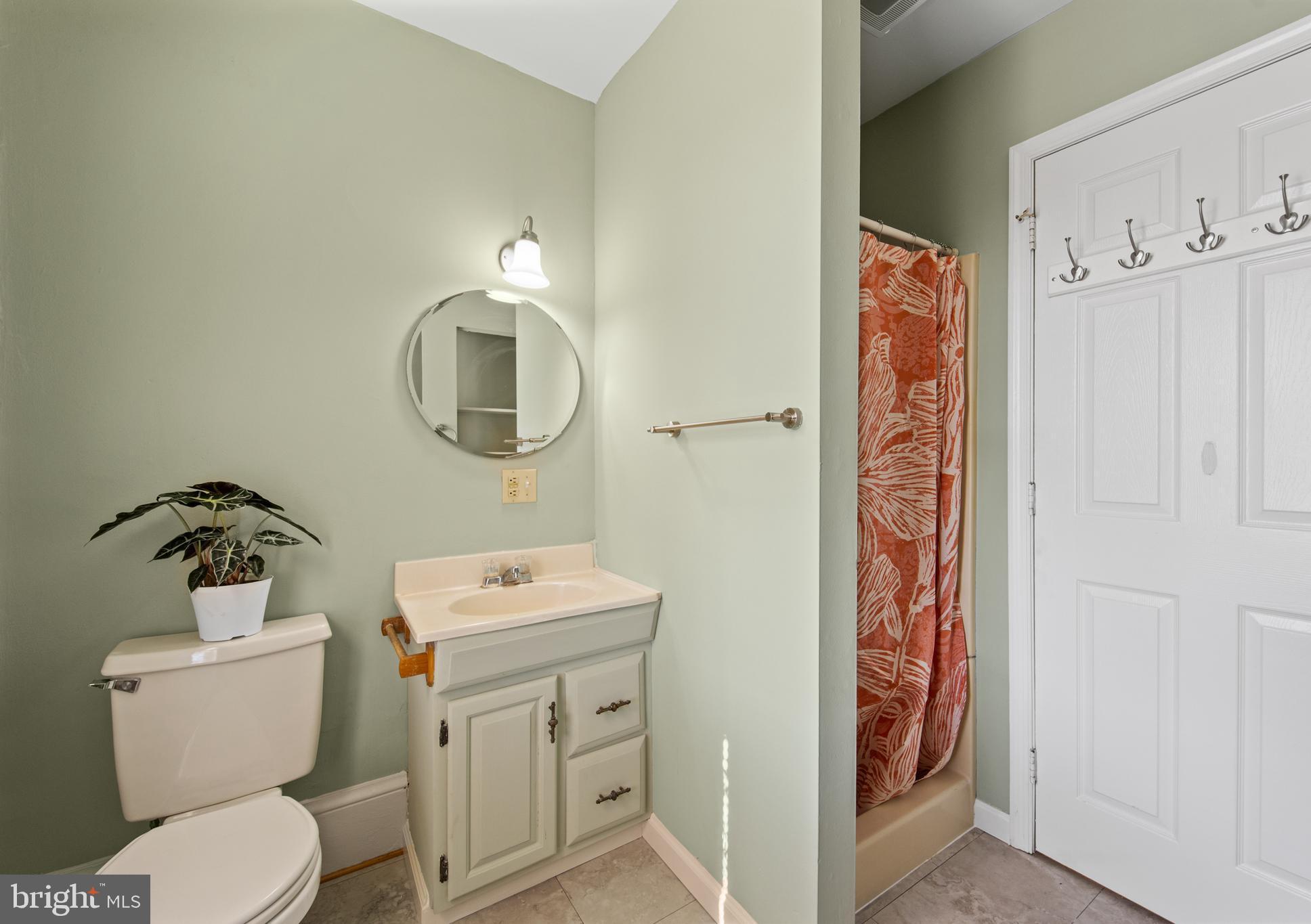 254 Chestnut Street Spring City, PA 19475 - Photo 21 of 37 a bathroom with a toilet sink vanity and mirror