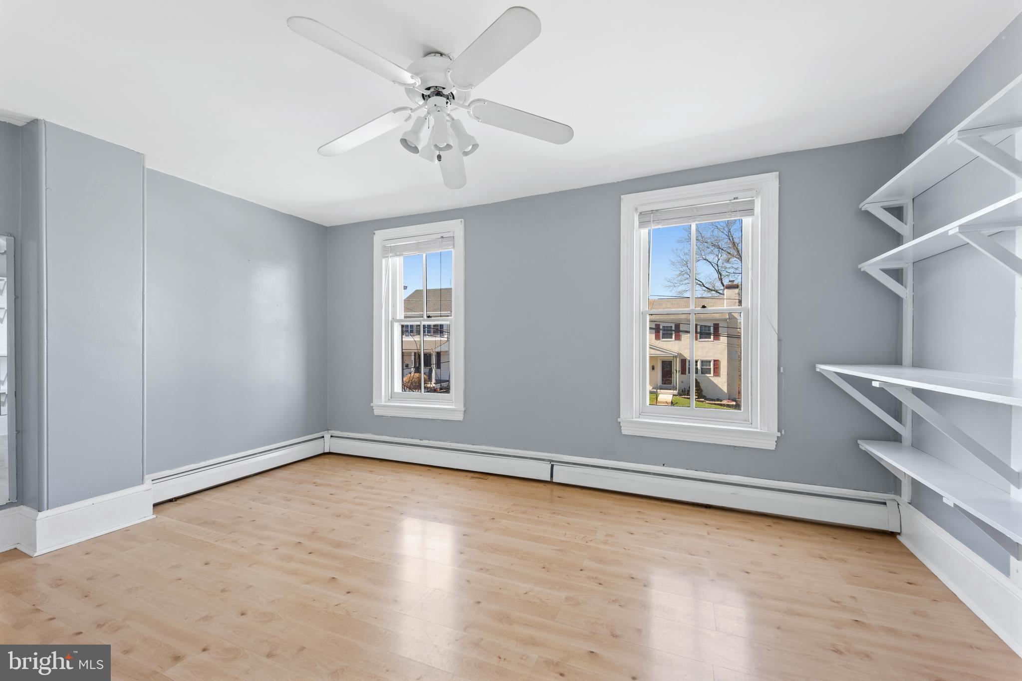 254 Chestnut Street Spring City, PA 19475 - Photo 25 of 37 a view of an empty room with a window and wooden floor