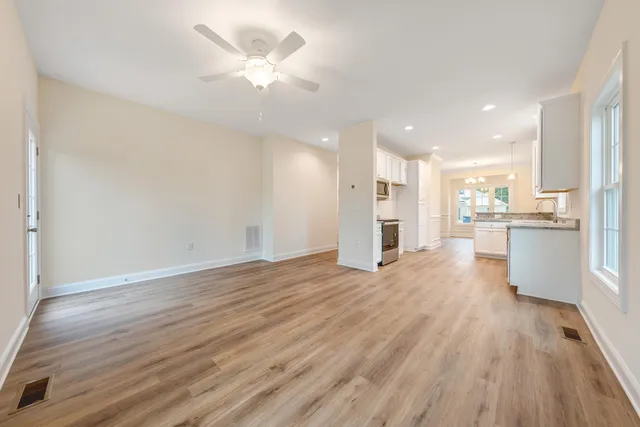 a view of kitchen with wooden floor and window
