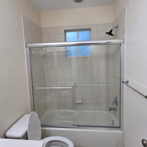 a bathroom with a sink double vanity and a mirror