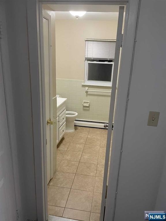 60 Maiden Lane, Unit 2 Little Ferry, NJ 07643 - Photo 11 of 22 a bathroom with a toilet and a sink